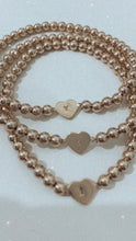 Load and play video in Gallery viewer, Initial Heart Bracelet- Gold Beads
